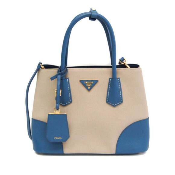 Prada Handbags - PRADA Cream Canvas Saffiano Shoulder Bag